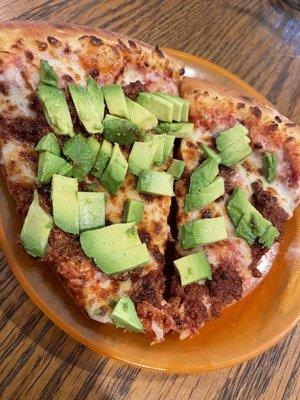 Chorizo pizza, avocado added at home.