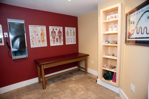 Floating shelves in the consultation room point to the feeling of levity one gets from one of Dr. Green's adjustments.