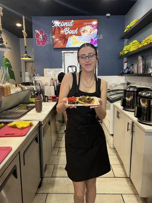 Shea offering our Avocado toast on sourdough bread topped with Microgreens.