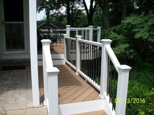 Trex Transcends with white vinyl rail & bronze aluminum balusters