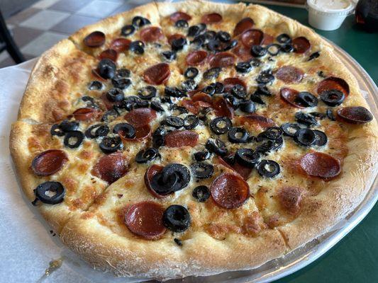 Garlic & olive oil sauce with pepperoni and olives.