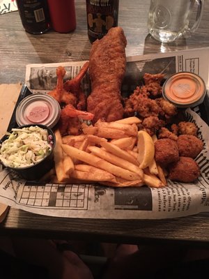 Rosco's trio: One piece of Alaskan Cod, jumbo shrimp, fried alligator with coleslaw, fries and hush puppies