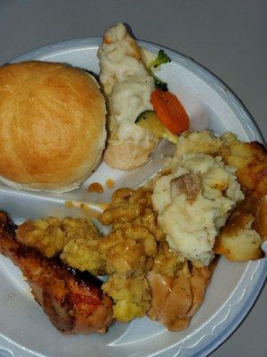 One plate of chicken, turkey roll ups, Chicken Frances, mashed potates, stuffing.