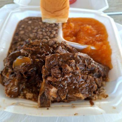 Smothered neck bones, yams, black eye peas and gravy with rice.