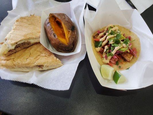 Cubano sandwich with a side of sweet potato and Mahi Mahi fish taco