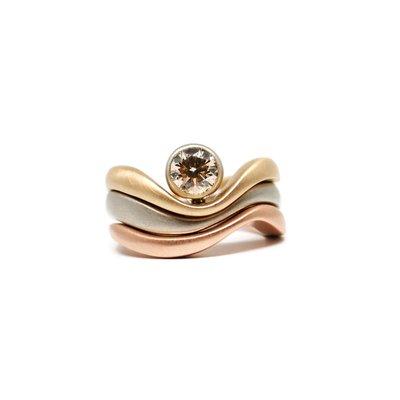 14k three tone wave stacking ring with champagne diamond. By Dwaine Ferguson.