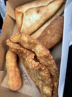 Potato and meat pie, chebureki, cheese triangles.