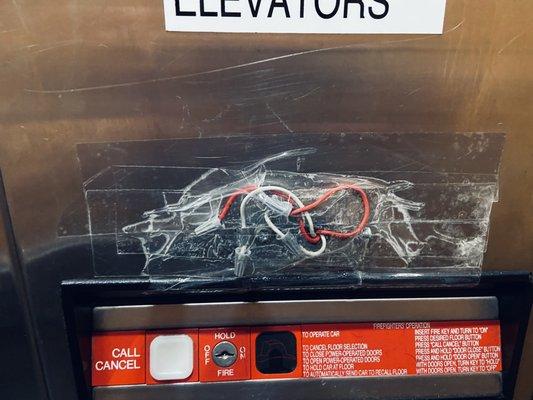 Public elevators wiring covered with packing tape