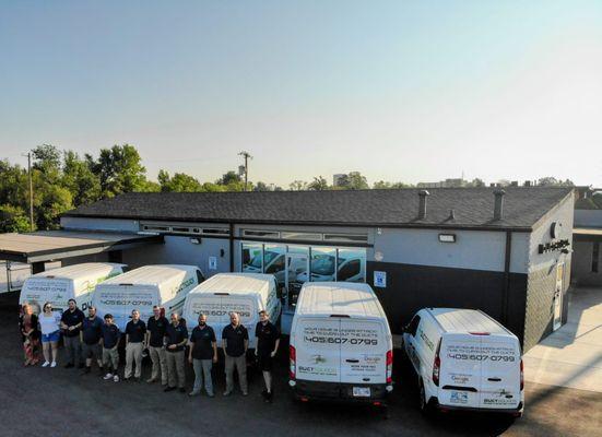 Outside our new building with our Duct Squad team and working Vans.