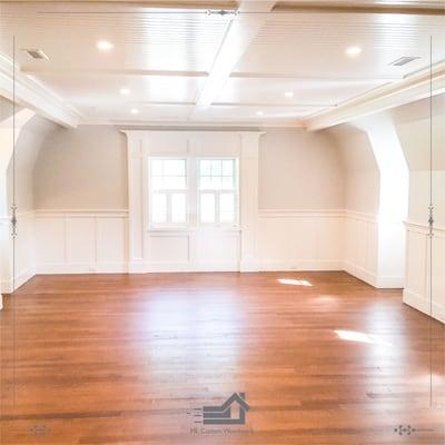 game room with shaker style wall panel and bead board panel ceiling and window seat built-ins