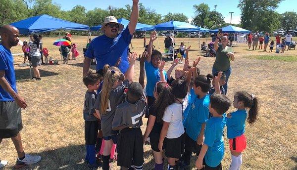 Coach Michael giving a pep talk to the kids before heading to the field!