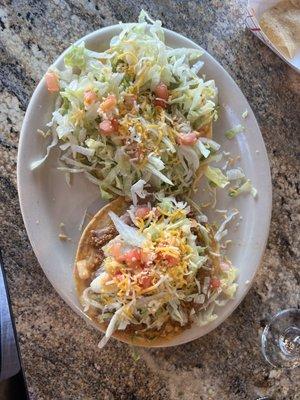 Guacamole tostada and a beef and bean tostada