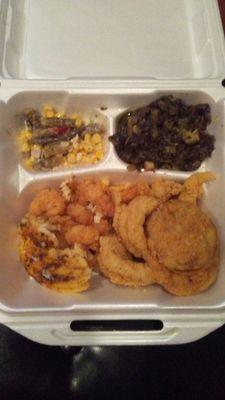 Fried green tomatoes, baked fish, shrimp, greens, and corn salad.