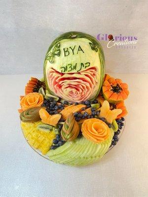 Custom carved watermelon and fruit arrangement for a bat mitzvah party