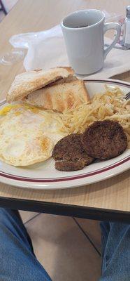 Just regular two egg breakfast Over medium hash browns light sausage patties white toast and cawfee