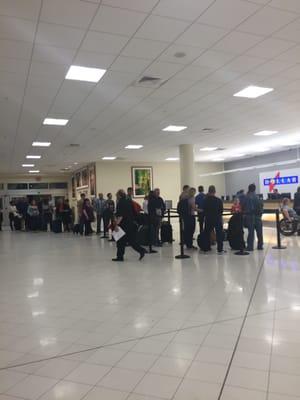 The enormous line at midnight of Thrifty/dollar ... An hour to get a rental car at this place