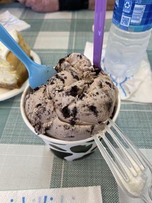 Double scoop ice cream. Chocolate on the bottom and cookies and cream on top.