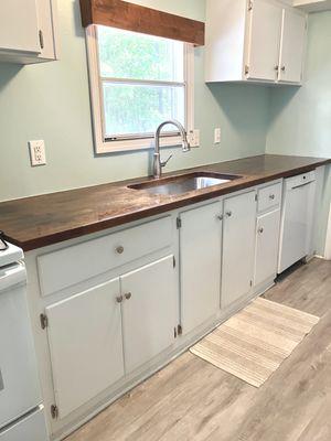 This is the after photo of the remodeled kitchen with butcher block countertop.