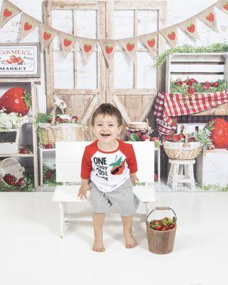 Strawberry themed photo with a 1 year old