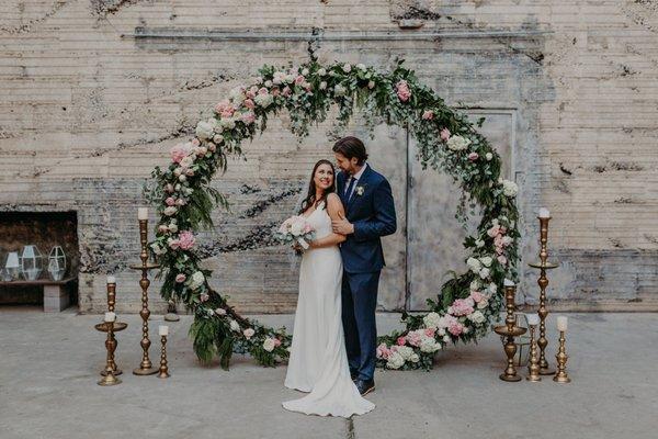 Our bride hired us to decorate her circle arch so we greened up this baby, added flowers, and made it gangster! We love floral installations