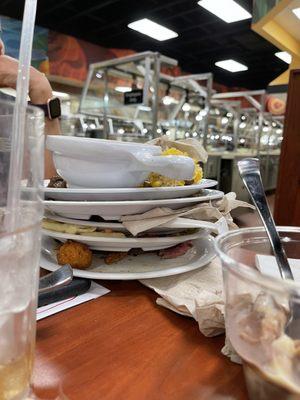 Plates stacked because waiter/waitress are useless here.