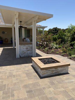 Stunning paver patio, custom fire pit, alumawood cover, and BBQ.