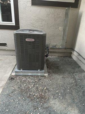 They moved the system to the left 4+ feet, then built a sheet metal retainer to block the dryer vent from expelling lint towards the system.