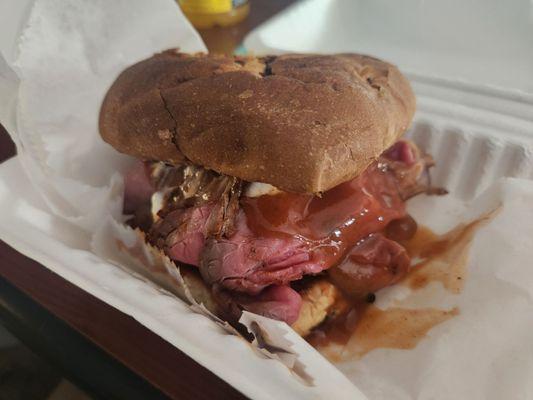 North Shore. Amazing. Shaved roast beef with mayo, BBQ sauce, American cheese, on a pillowy grilled onion roll.