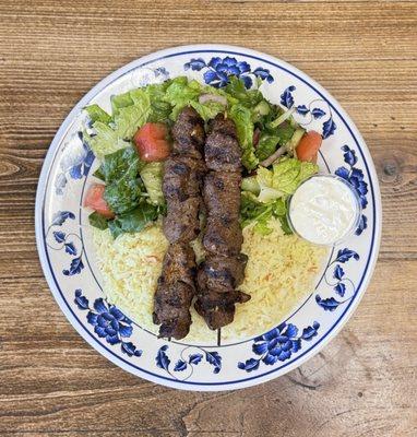 Lamb Kabobs Plate - 2 lamb skewers served with rice, salad, tzatziki & pita