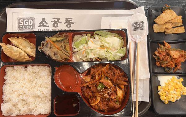 Bento box with spicy stir fried pork