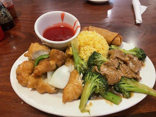 Combination of sweet and sour chicken and beef with broccoli