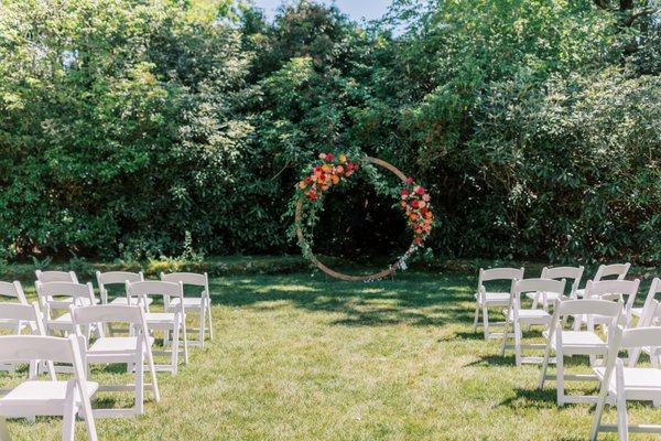 Great use of our round arbor with summer flowers & greenery