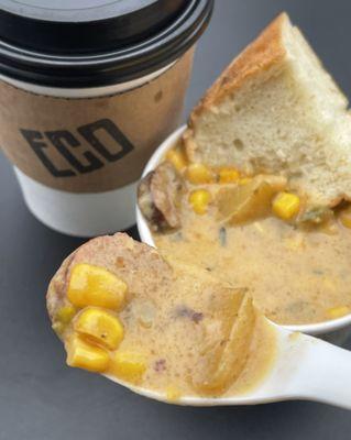 Cup of Cajun smoked sausage corn chowder, Cajun sausage, potatoes, corn and creamy broth