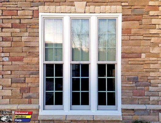 Renewal by Andersen, double hung windows with white exterior and colonial grilles