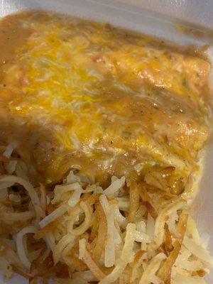 Breakfast burrito smothered in green Chile w/homemade hash browns.