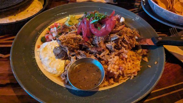 Carnitas plate entree. Had to take half to go. A lot of food! (Especially if you ate chips and salsa up front!)