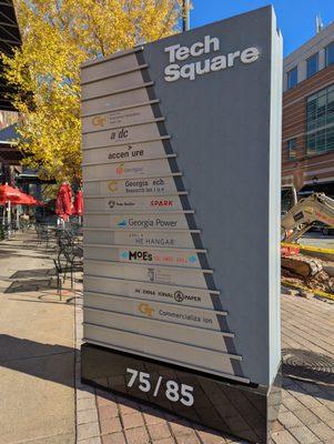 Georgia Tech Technology Square sign directory on sidewalk at 5th St NW and Williams St NW.