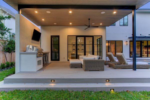 Contemporary outdoor living with composite deck and outdoor kitchen