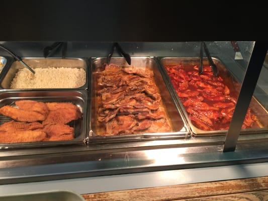 Part of the steam table lineup - BBQ Chicken, Pork Chops, Fish, & Rice