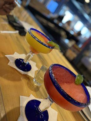 Margaritas. On the right, we have strawberry and blackberry and on the left, we have mango and strawberry frozen.