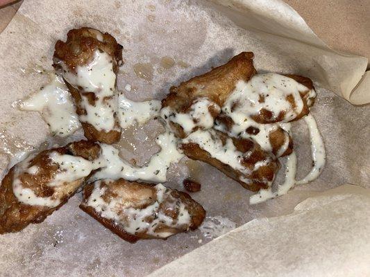 Soggy plain wings with alfredo sauce on them instead of garlic parm. gross.