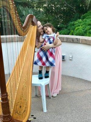 Kristie Smith, harpist, with her adorable daughter.