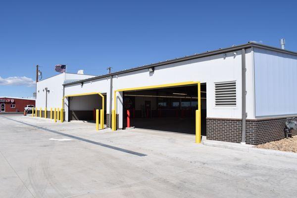 A photo of the exterior of the 4-lane drive-thru at High Plainz Strains, taken during the day