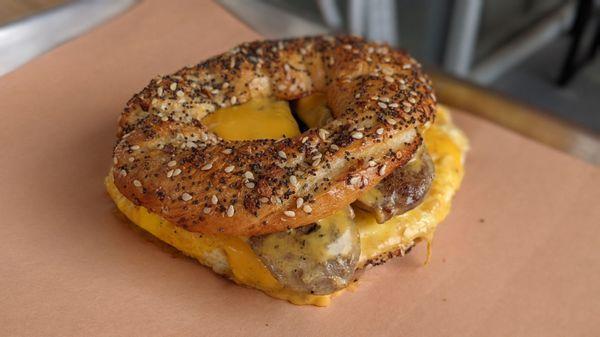 Sausage, egg, and cheese on an everything bagel