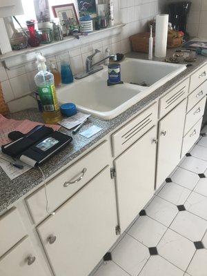 This is a picture of my very small kitchen counter. I need to replace the sink and countertop and find a nice looking faucet.