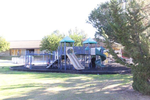 Our elementary playground includes a fun climbing structure, large grassy field, basketball court, and baseball backstop.