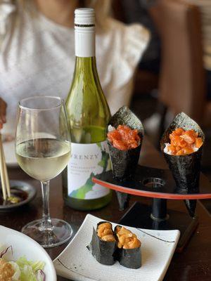 Uni, spicy tuna hand roll & spicy salmon hand roll. Oh and a bottle of Sauvignon Blanc