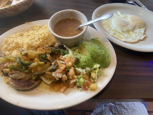 Pork chop rancheras, rice, charro beans, 2 eggs over easy.