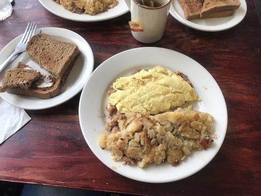 Corn Beef Hash, Home Fries and Wheat Toast.