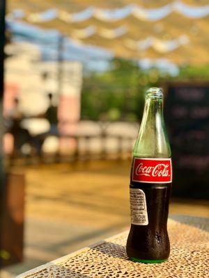 Mexican Coke patio vibes. One of OKC's best restaurant patios. The fans and strategic shading do their jobs well. July 2021